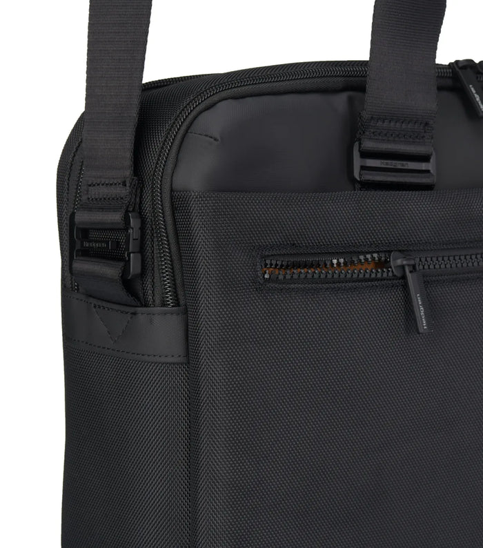 Black textured fabric hedgren byte laptop briefcase with adjustable shoulder strap and zippered front pocket fits laptops