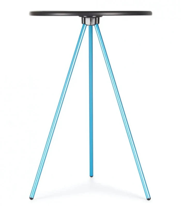 Tripod style camp table with a circular hard surface top