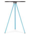 Tripod style camp table with a circular hard surface top