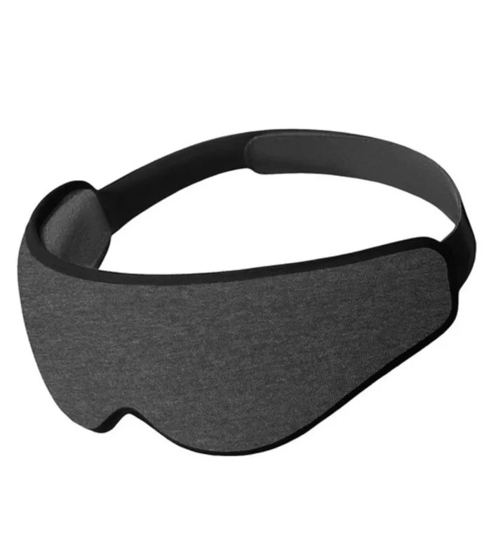 Ostrichpillow eye mask in dark night with soft fabric and adjustable strap for a blackout experience and ergonomic fit