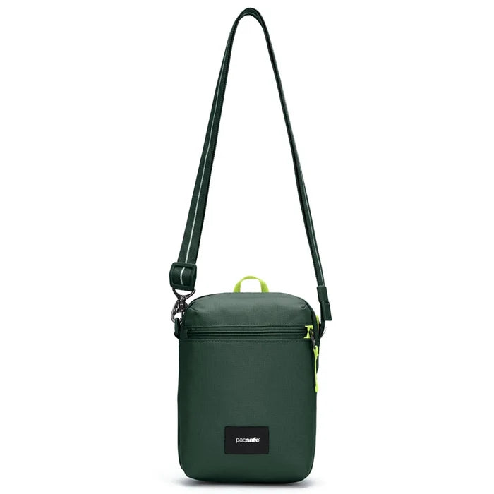 Dark green pacsafe go anti-theft festival crossbody bag with black strap neon yellow accents and dock lock system