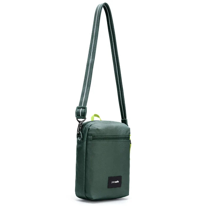 Pacsafe go anti-theft festival crossbody bag in spruce green with dock lock and adjustable strap for easy carrying