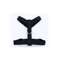 A black nylon pet harness with plastic quick-release buckles and a silver metal D-ring, shown flat on a white background.