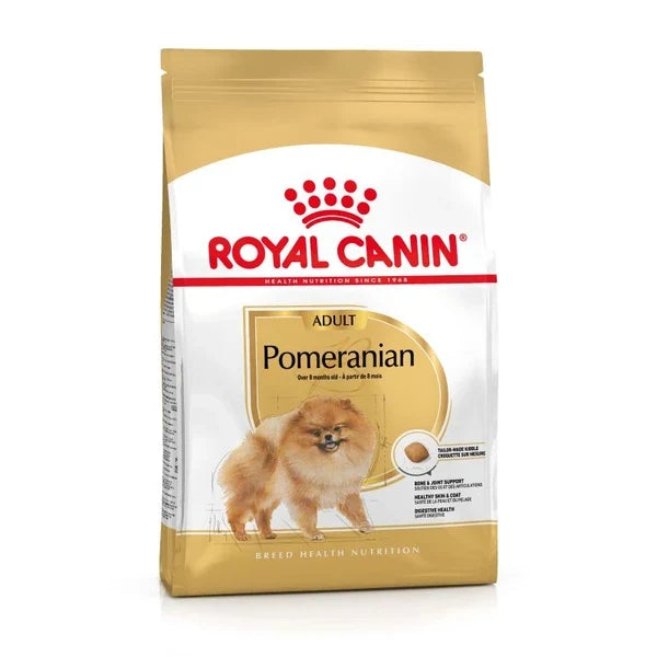 A bag of Royal Canin Pomeranian adult dog food, featuring a white and gold package design with a picture of a fluffy Pomeranian dog on the front.