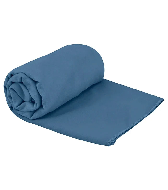 A neatly rolled sea to summit drylite towel medium in moonlight blue with smooth texture and microfiber material