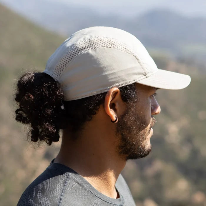 A Sunday Afternoons Aerial Sport Cap being worn outdoors