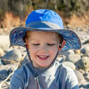 A child wearing a Sunday Afternoons Kids Clear Creek Boonie Hat