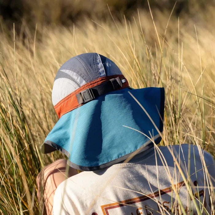 A child wearing a Sunday Afternoons Kids Ultra Adventure Hat