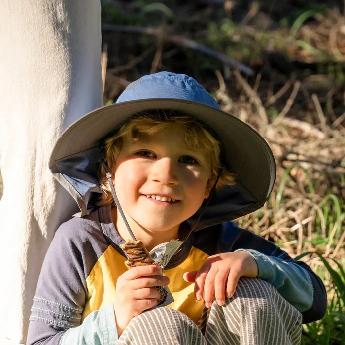 A child wearing a Sunday Afternoons Kids Ultra Adventure Hat