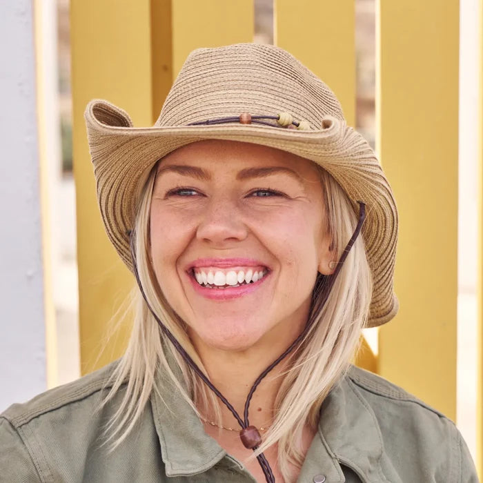 A woman wearing a Sunday Afternoons Sunset Hat