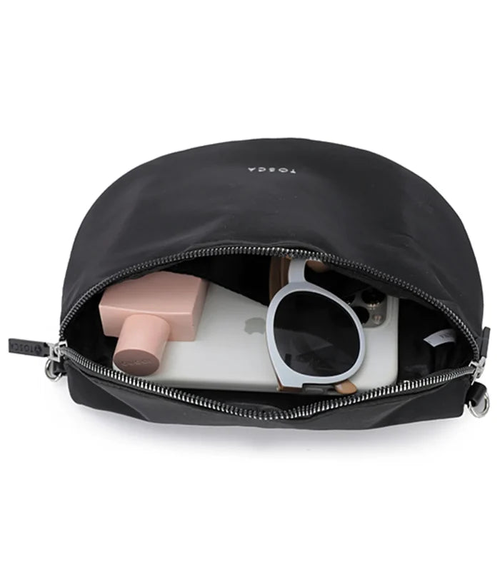 Black togga pouch inside the tosca harlow sling bag black made of composite memory nylon with zipper compartments