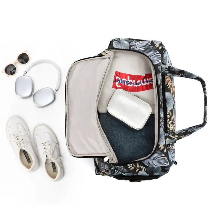 Tosca so lite onboard wheel bag with black and gray floral pattern and beige interior with red logo patch inside